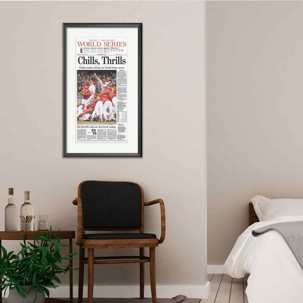 "Chills, Thrills" Phillies World Series 2008 Reprint Framed with Mat, Hanging on Wall Behind an Elegant Set of Furniture
