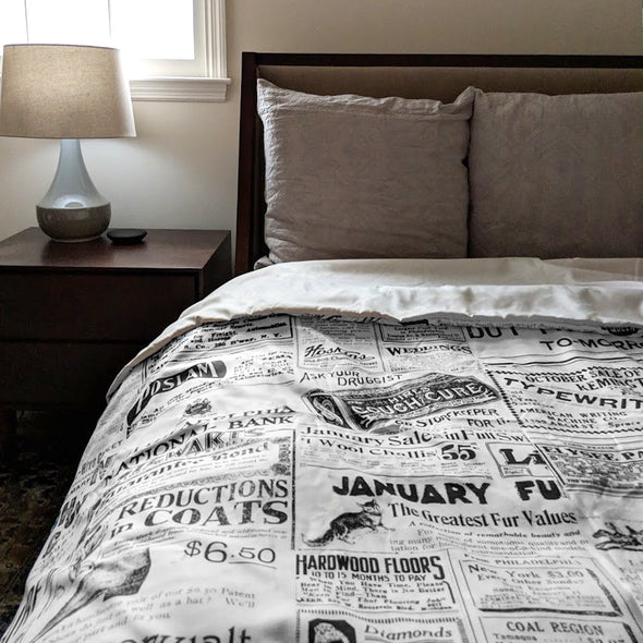 Vintage Inquirer Ad Collage Duvet Cover in Bedroom with Nightstand and Lamp beside bed with pillows
